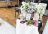 
			
				                                Flowers surround a memorial inside Woodforest Bank, the site of a shooting that took the life of Brandy Nicole Olson, 42.
 
			
		