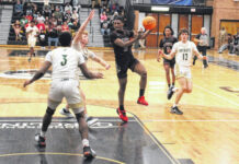 
			
				                                Lumberton’s Amare Jones (5) looks to pass as Pinecrest’s Elijah Melton (3) defends during the Robeson County Shootout championship game Dec. 21 in Pembroke.
                                 Chris Stiles | The Robesonian

			
		