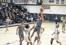 
			
				                                Purnell Swett’s Sean Locklear (13) takes a shot attempt over Cape Fear’s Joshua Green (22) during Friday’s game in Fayetteville.
                                 Chris Stiles | The Robesonian

			
		